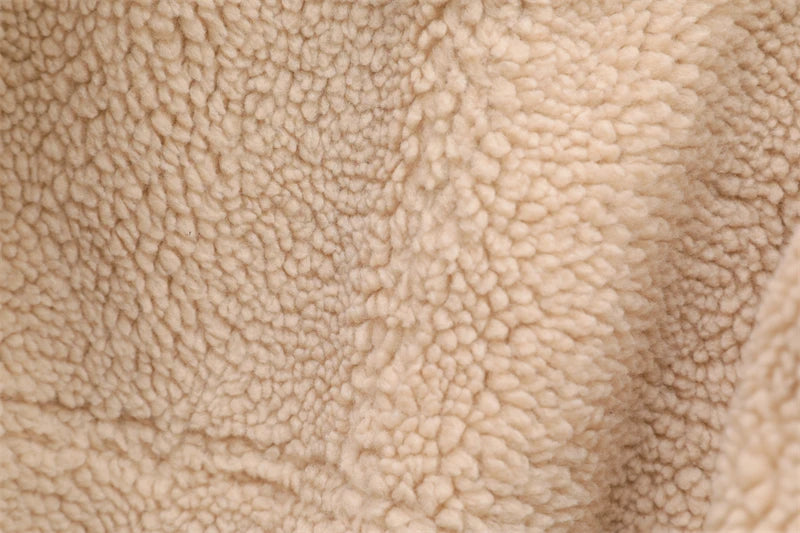 Manteau femme chaud en fausse fourrure shearling, style vintage ceinturé.