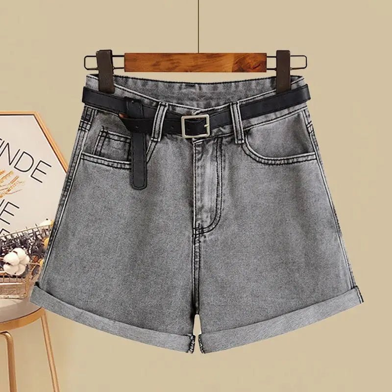 Grey denim shorts with rolled hems and a black belt, perfect for a casual spring/summer look.