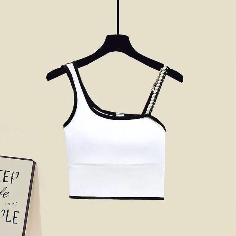 Stylish white crop top with asymmetrical straps and decorative chain detail, perfect for a trendy summer look.