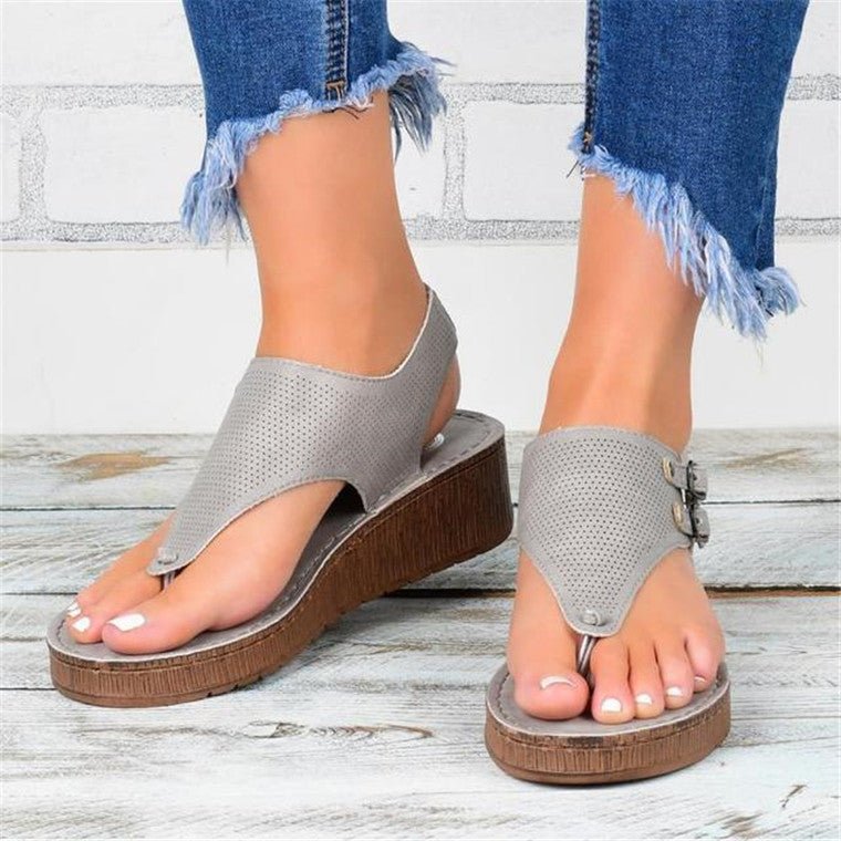Women's hollow flat heel flip flops sandals.