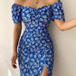 Robe d’été élégante à imprimé floral, manches courtes, épaules dénudées. Idéale pour les soirées et événements.