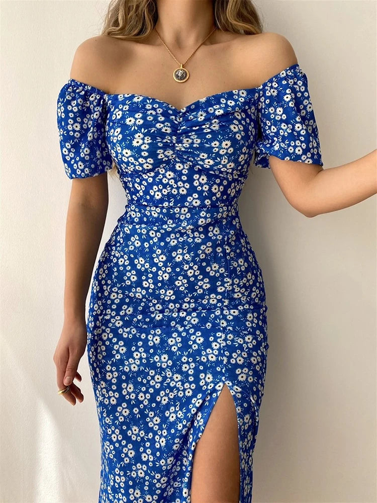 Robe d’été élégante à imprimé floral, manches courtes, épaules dénudées. Idéale pour les soirées et événements.