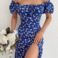 Robe d’été élégante à imprimé floral, manches courtes, épaules dénudées. Idéale pour les soirées et événements.