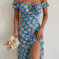 Robe d’été élégante à imprimé floral, manches courtes, épaules dénudées. Idéale pour les soirées et événements.