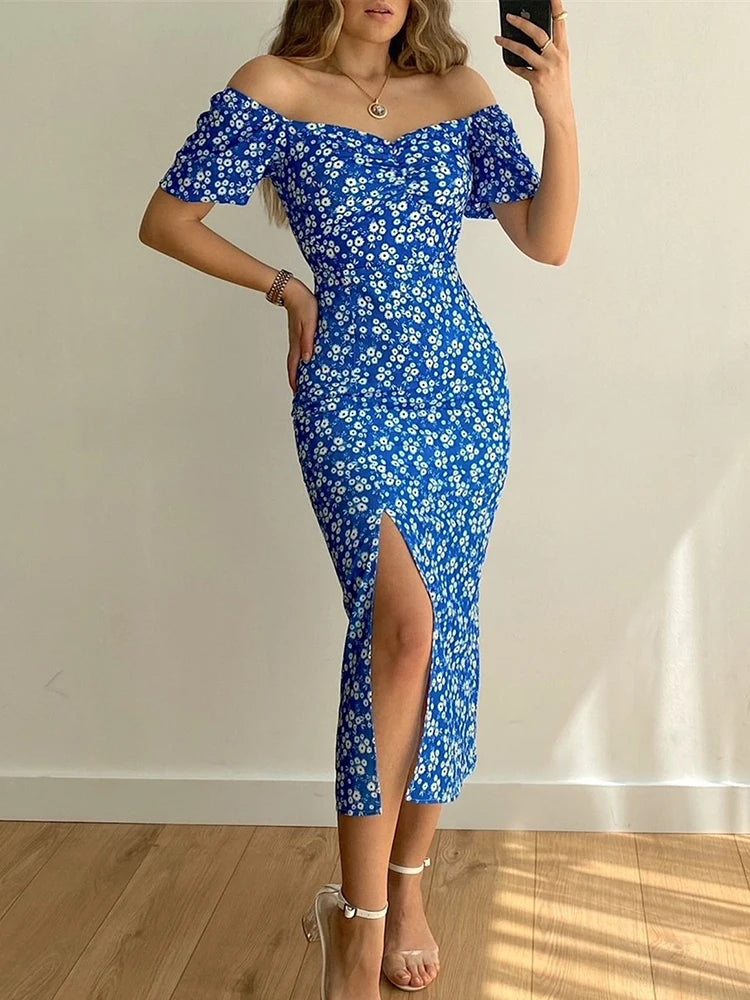 Robe d’été élégante à imprimé floral, manches courtes, épaules dénudées. Idéale pour les soirées et événements.