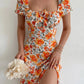 Robe d’été élégante à imprimé floral, manches courtes, épaules dénudées. Idéale pour les soirées et événements.
