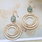 European And American Fashion Creative Hollow Round Vortex Inlaid Sapphire Earrings.
