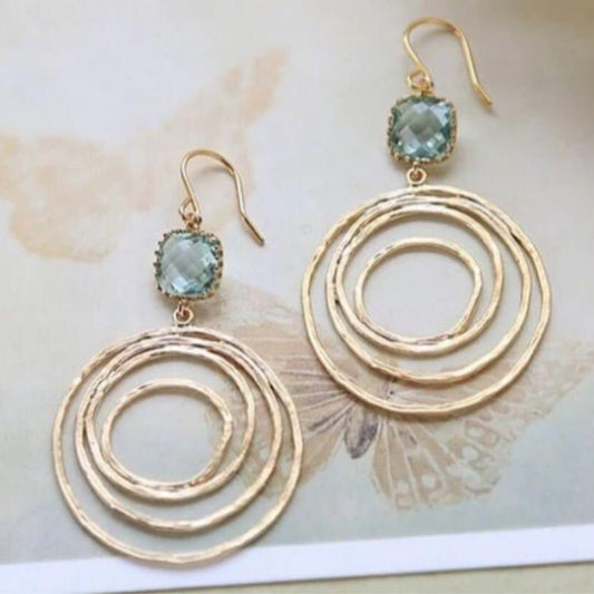 European And American Fashion Creative Hollow Round Vortex Inlaid Sapphire Earrings.