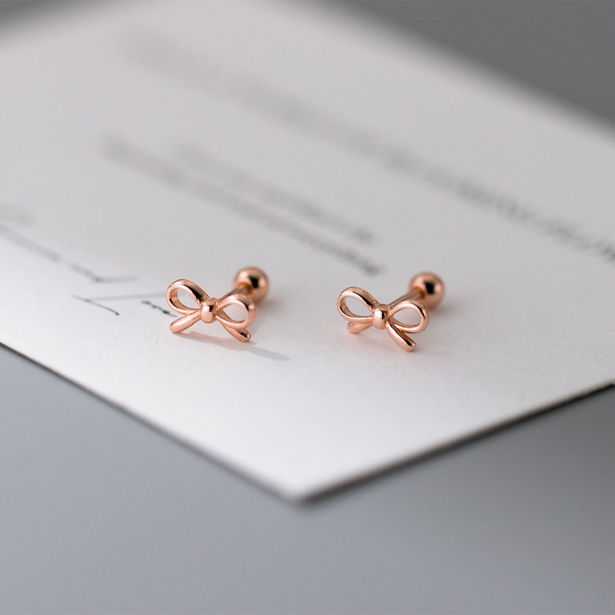 Fashion Hollowed-out Bowknot Thread Stud Earrings.