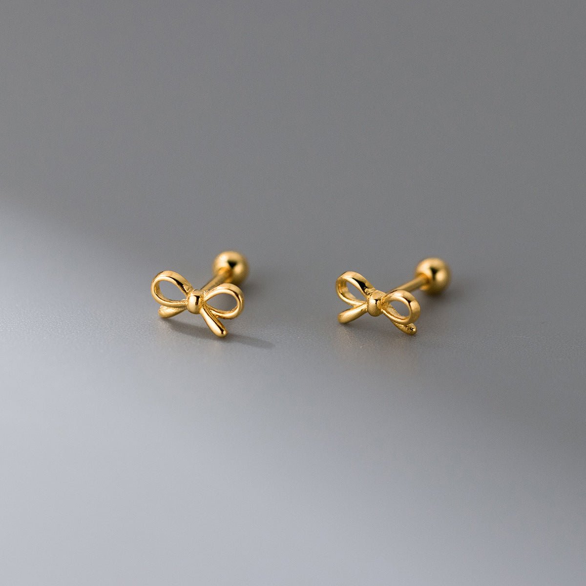 Fashion Hollowed-out Bowknot Thread Stud Earrings.