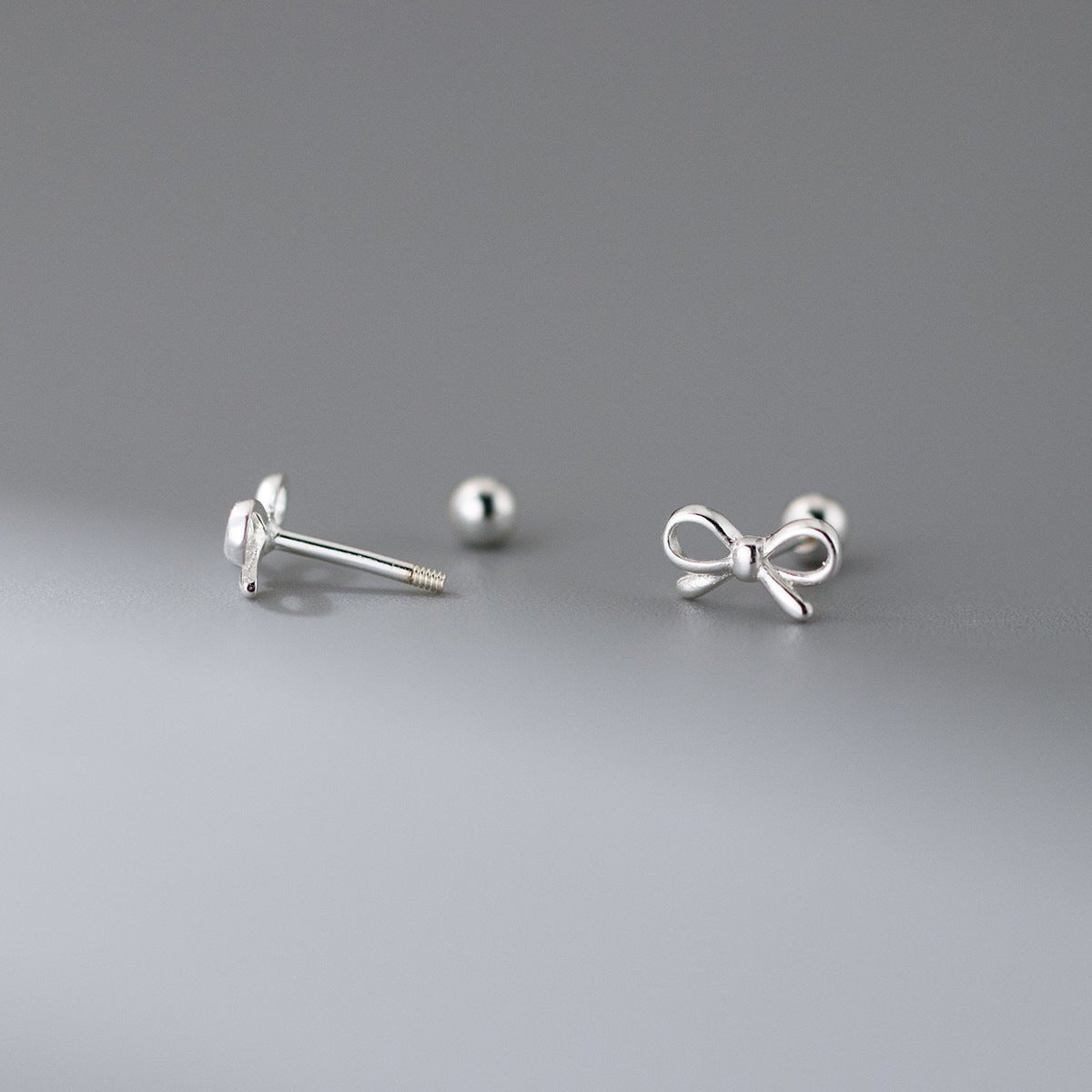 Fashion Hollowed-out Bowknot Thread Stud Earrings.