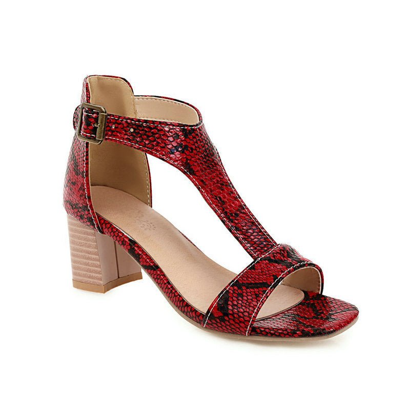 Snakeskin high-heeled chunky sandals.